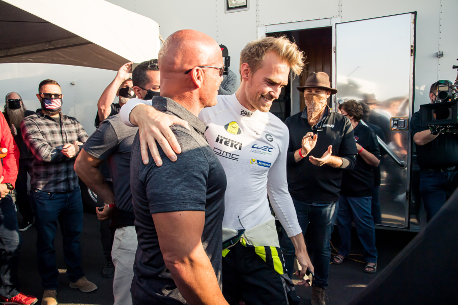Driver hugged in celebration, showcasing the camaraderie after the SSC Tuataras record-breaking speed run.