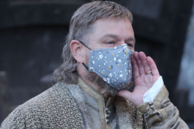 Matt Damon with mullet wearing a mask