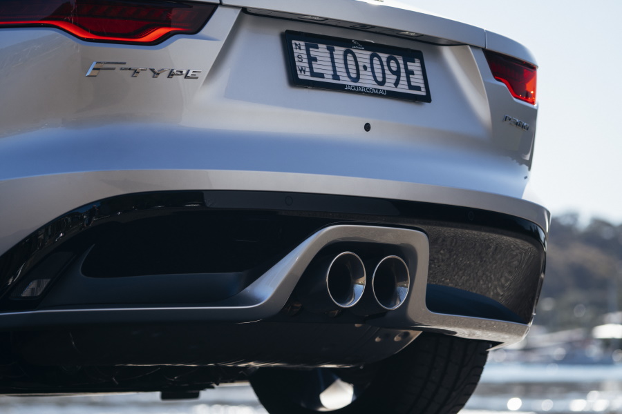Rear view of the silver 2021 Jaguar F-type rear view showing number plate and exhaust pipes