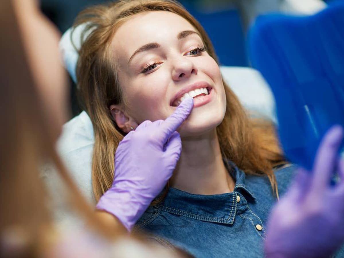 woman on a dentist's chair at enhance dental
