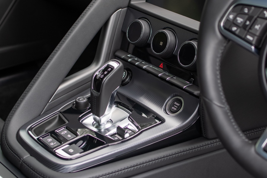 Interior of the 2021 Jaguar F-type showing the gear shift and car controls