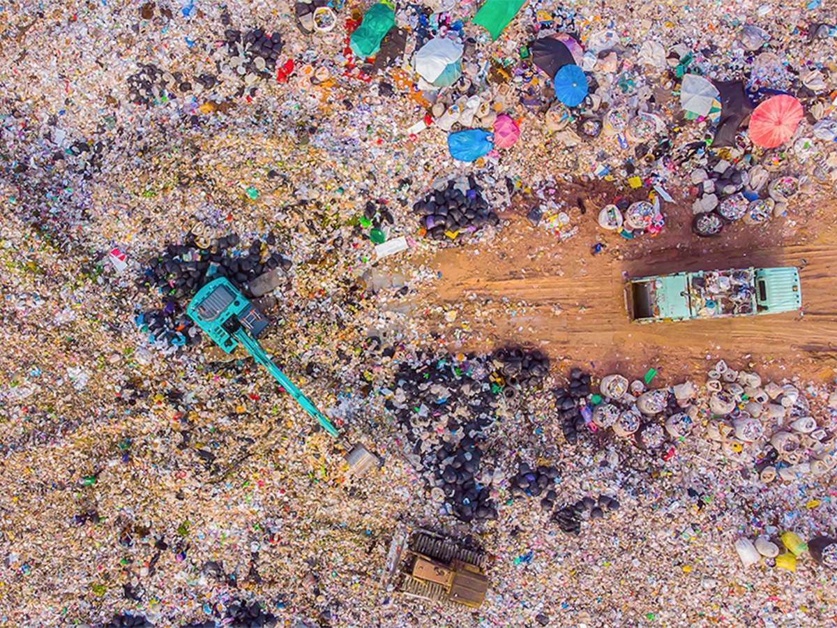 Aerial view of machines working at a garbage dump