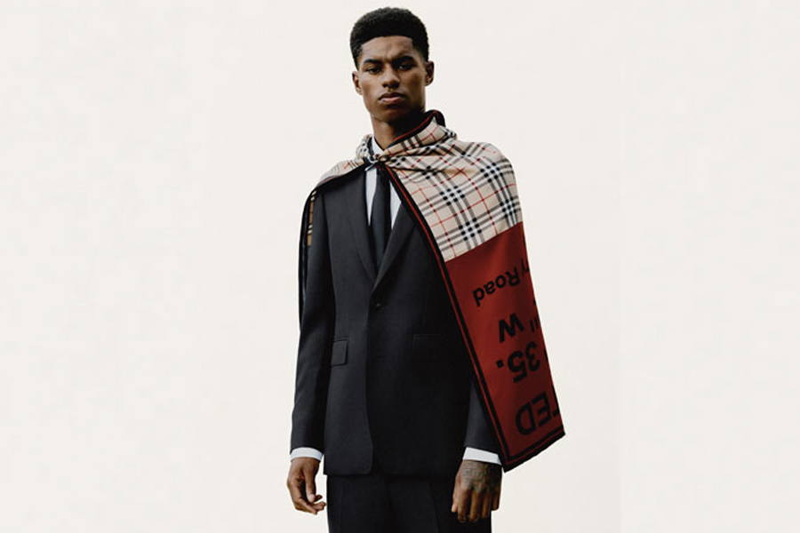 Marcus Rashford in a Burberry suite with a cape