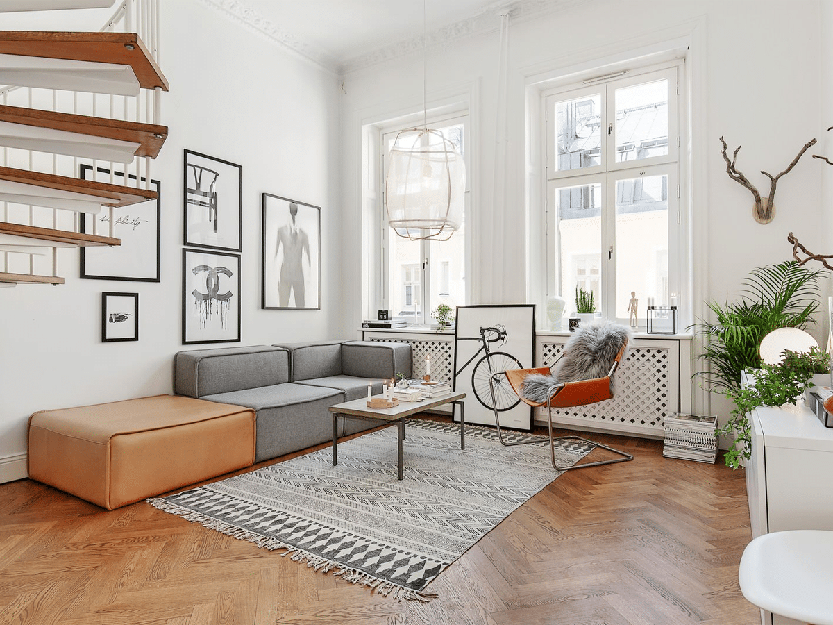 Masculine living room brown wood, orange, grey, and white colour scheme interior design