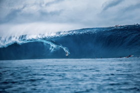 A surfer riding a big wave