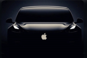 Silhouette of front of Apple car with logo visible