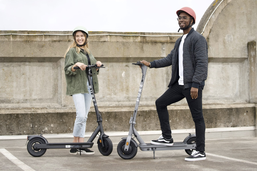 Man and a woman on electric scooters