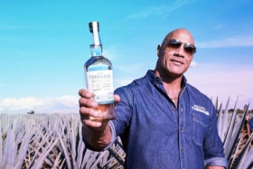 The Rock holding a bottle of Teremana Tequila