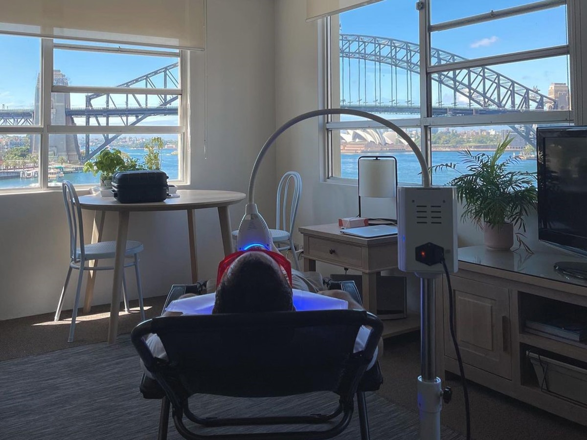 patient lying on chair during procedure of teeth whitening at whitening by b clinic