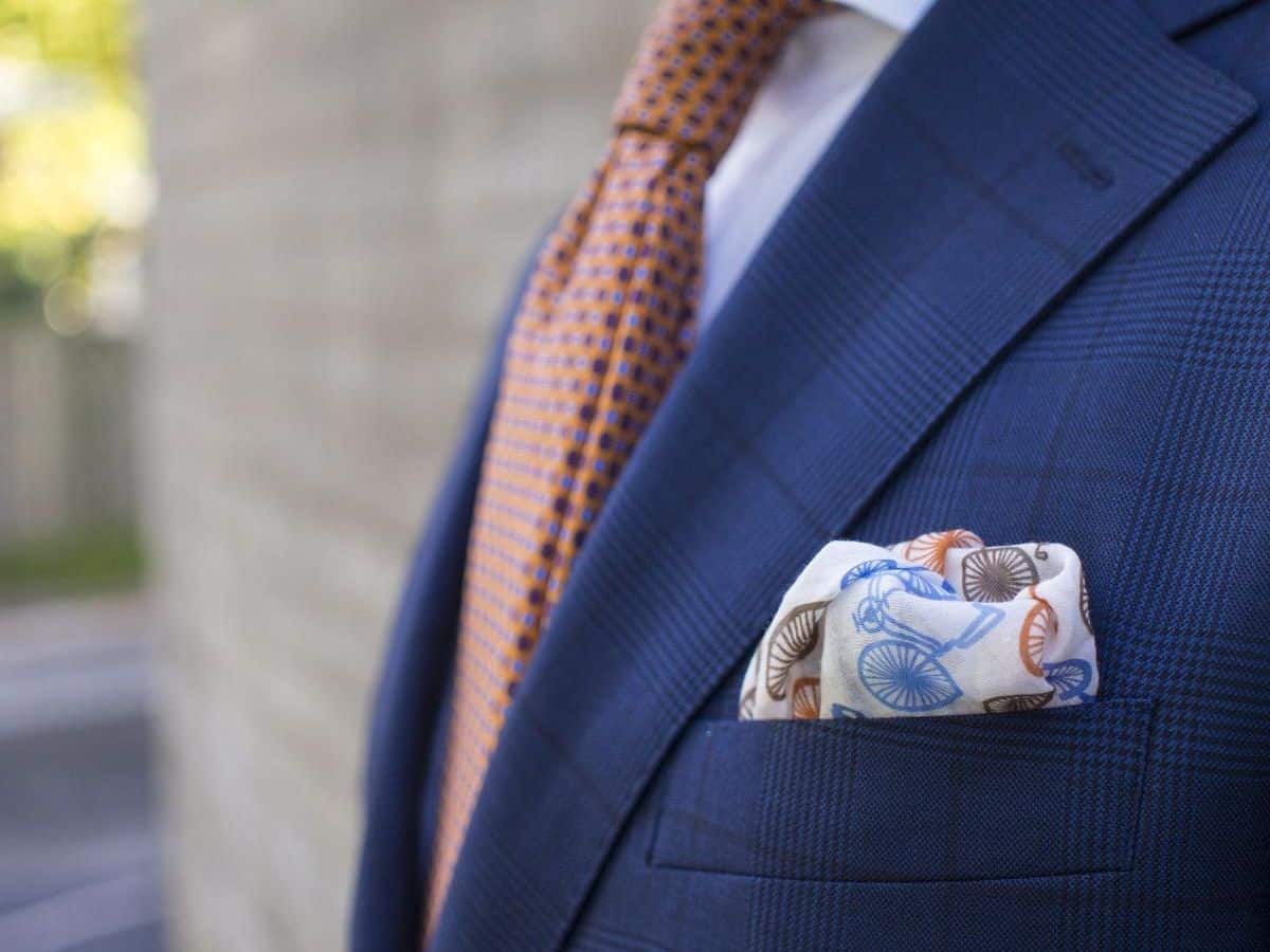 Navy suit pocket with white pocket square