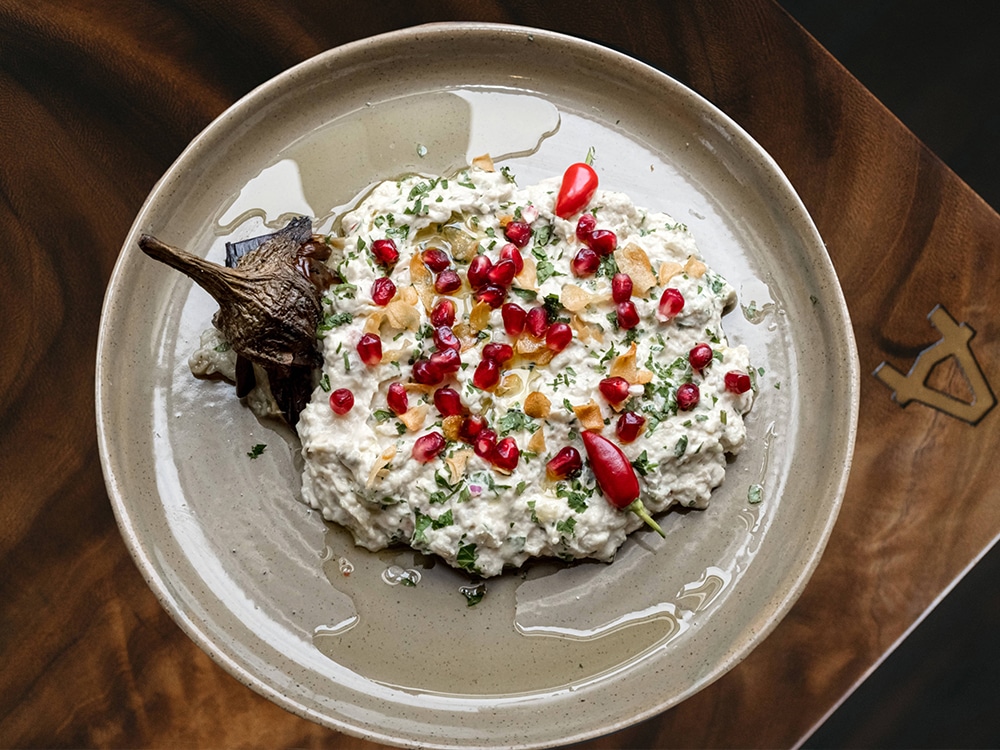 A dish on a plate at KNAFEH