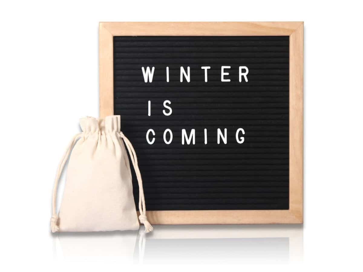 Letter Board reading Winter is Coming and a pouch in front of it