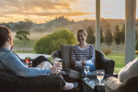 Group of people drinking wine outdoors