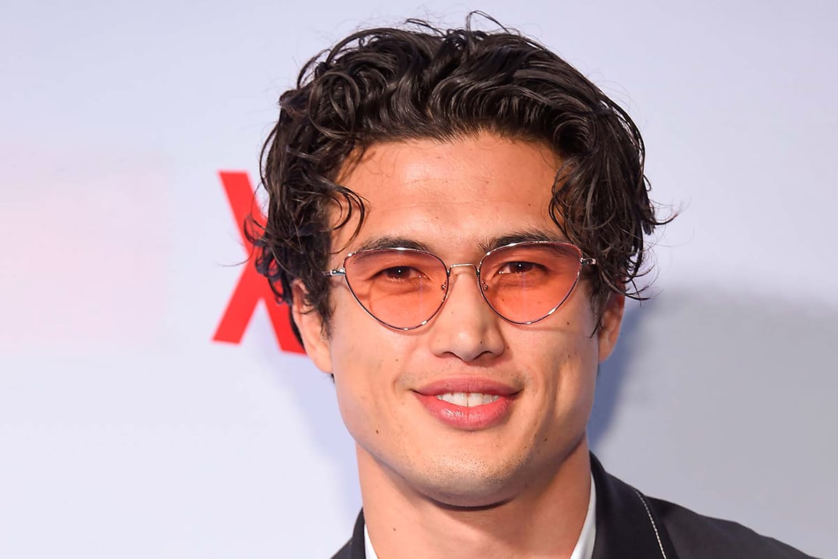 Charles Melton with men's wavy styling middle part hairstyle | Image: Netflix