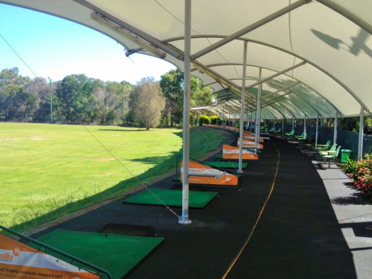 A golf driving range with shade