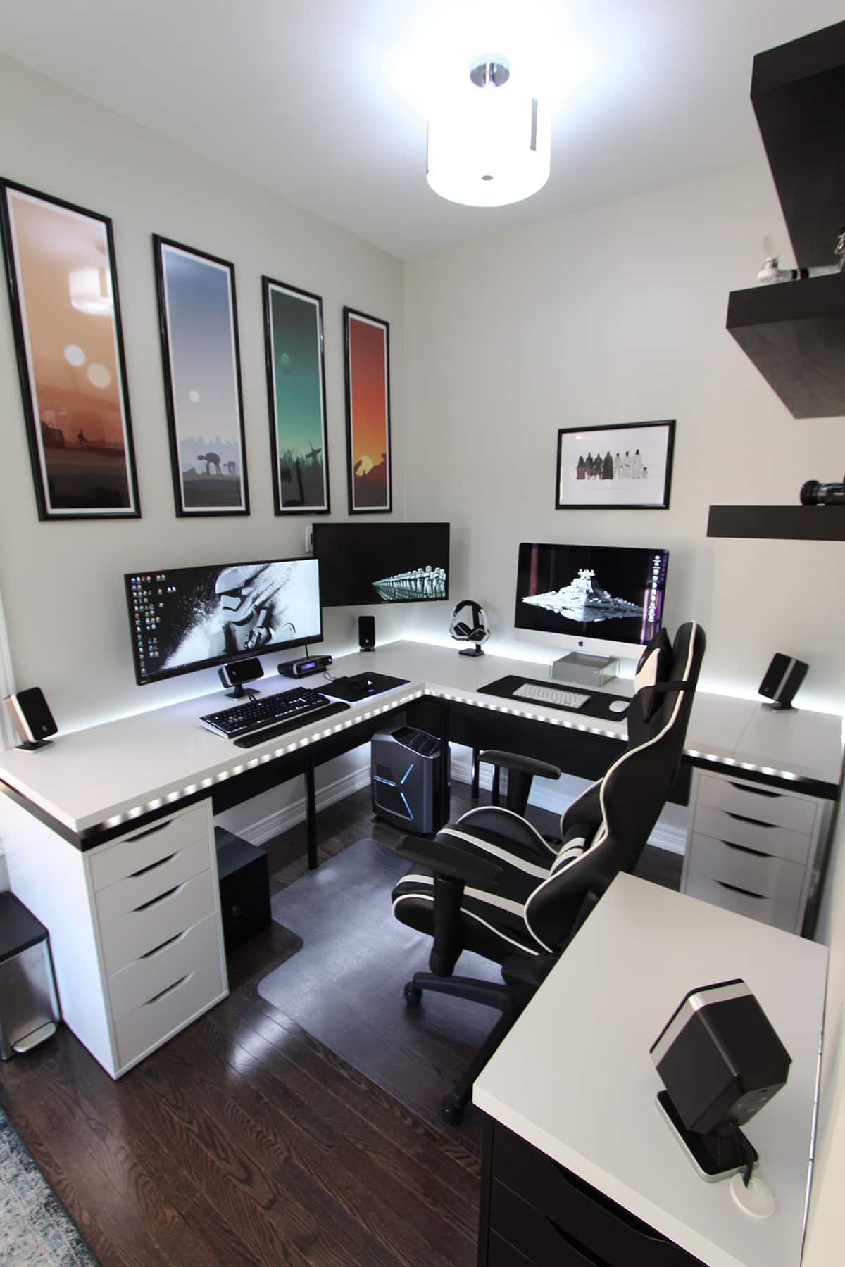 L-shaped desk with three screens and a gamer chair in front
