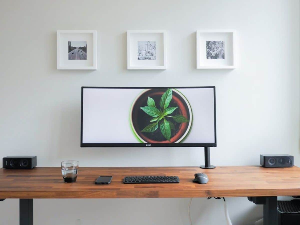 Wood desk with a wide monitor