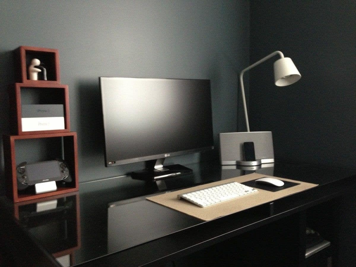 Black desk with black wall behind