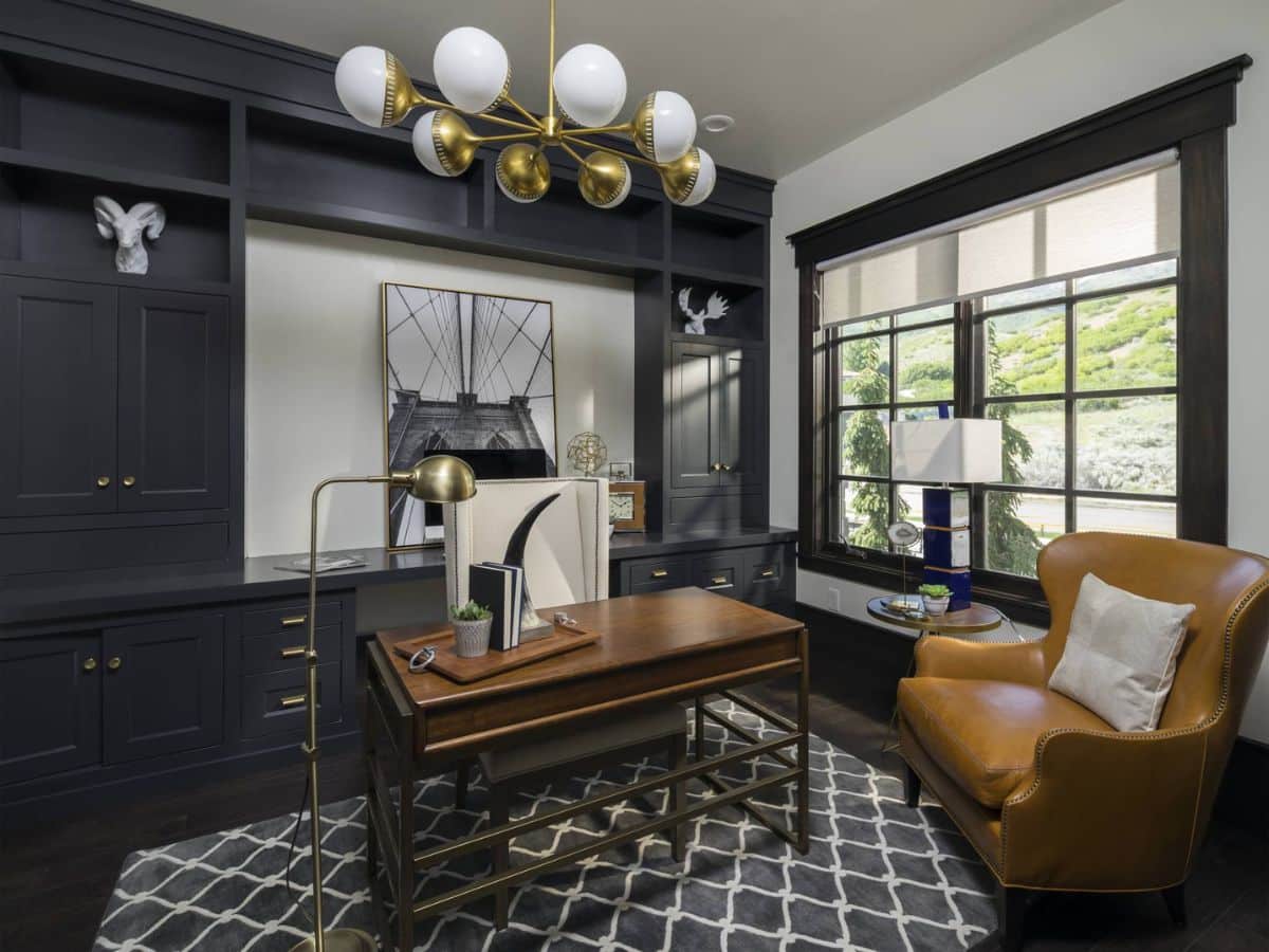 Home office with black wood cabinet wall