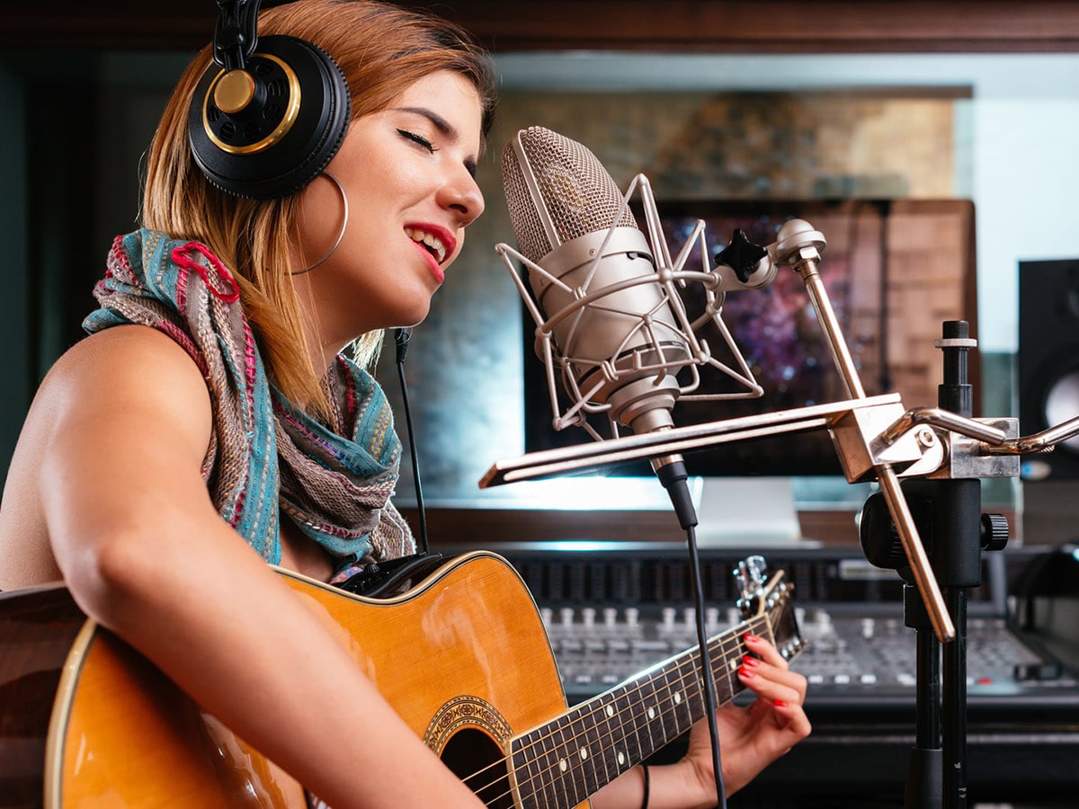 Young Female Singing In Music Studio