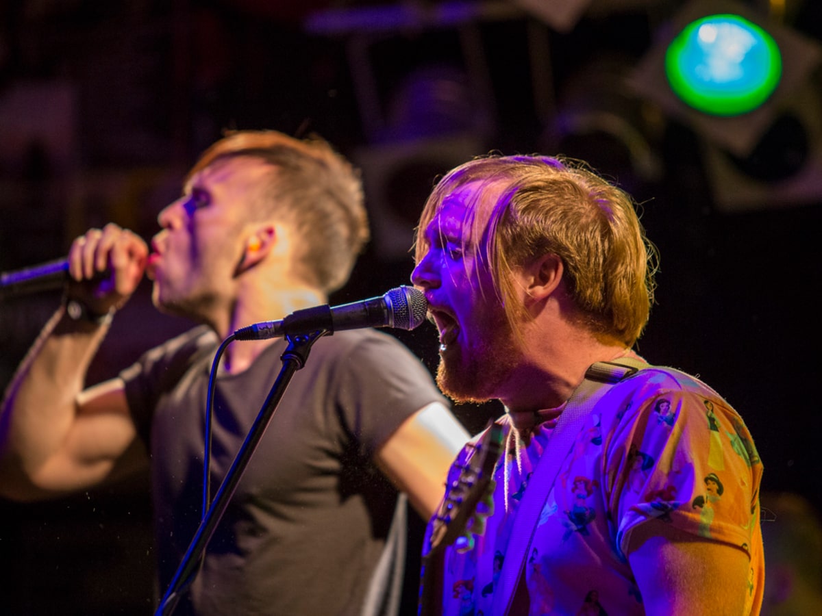 two singers performing during live music concert