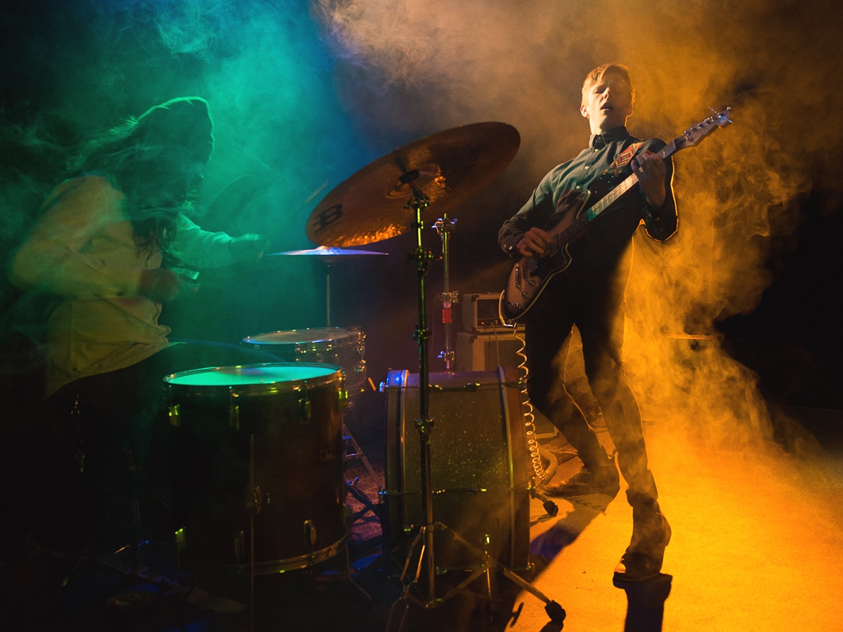 man playing guitar at live concert