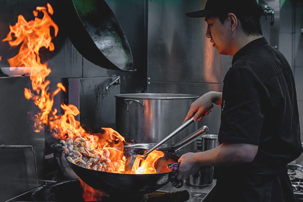 Zhongyi Clay Pot Restaurant Chef Cooking with Fire