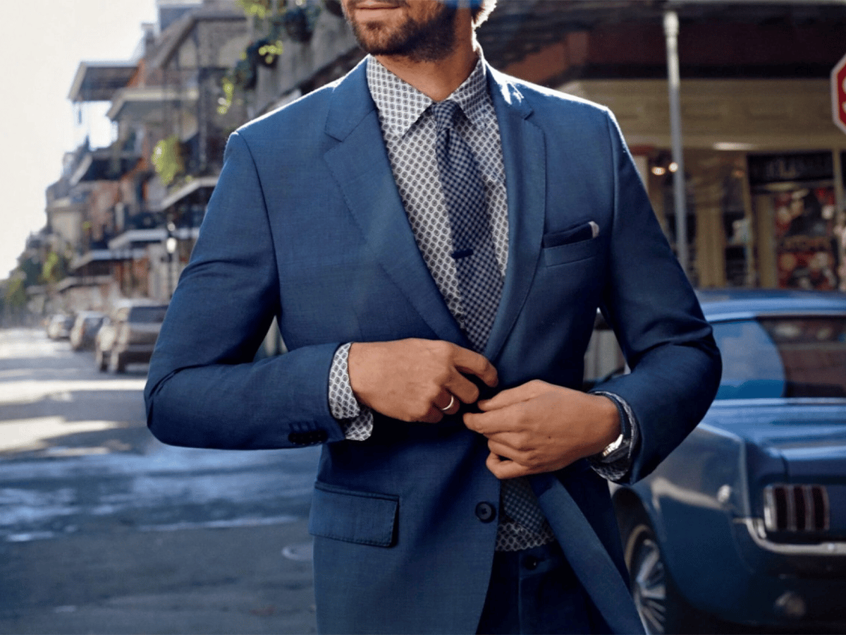 blue shirt and navy suit