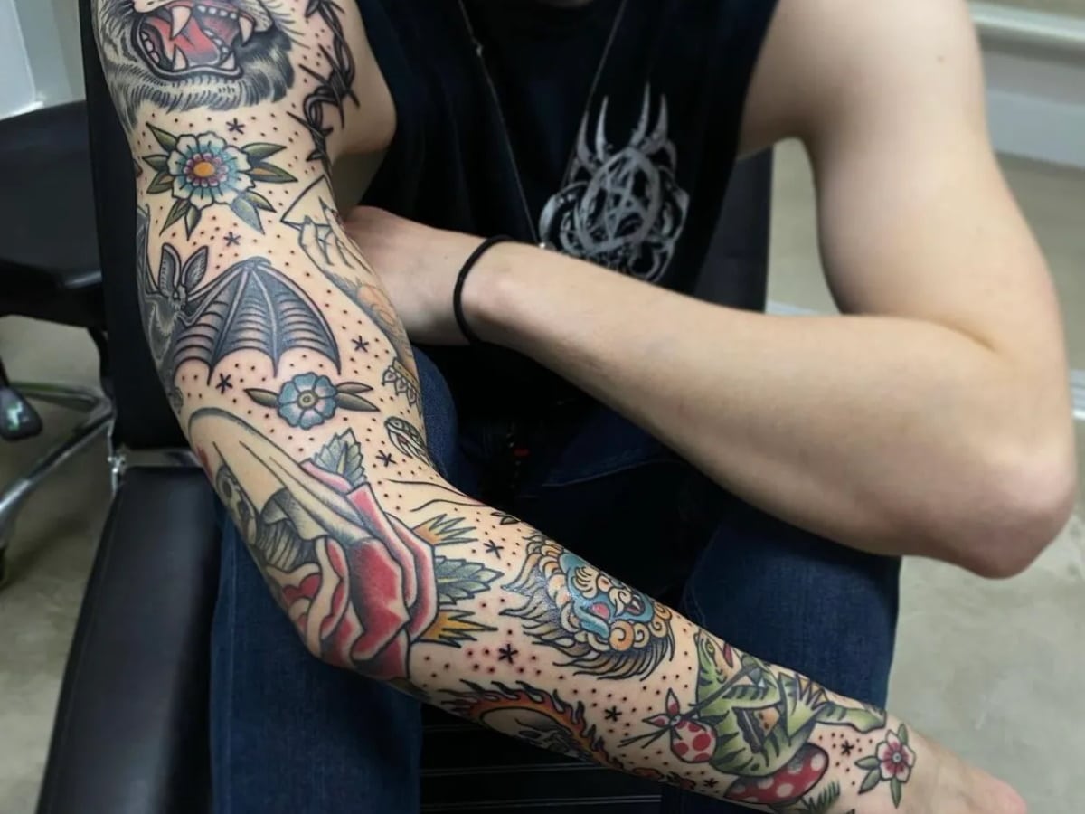 I want a black and grey tattoo sleeve but I don't want it too black or dark.  What should I tell the tattoo artist? I'll leave photos of what I mean as