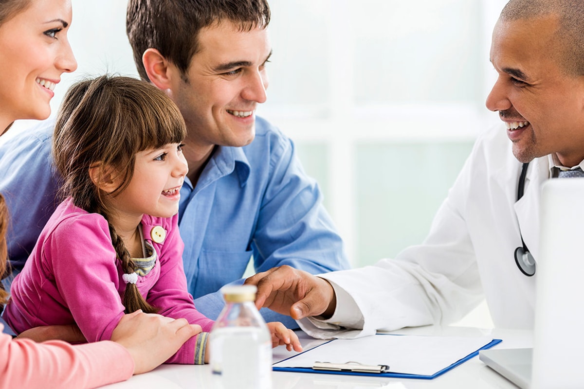 Happy Family On A Visit To The Doctor