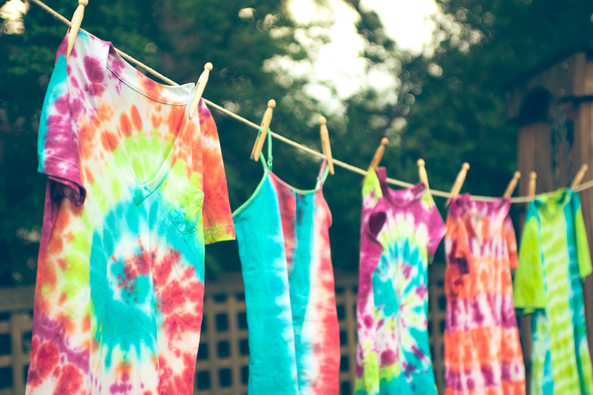 tie dye clothes hanging on rope
