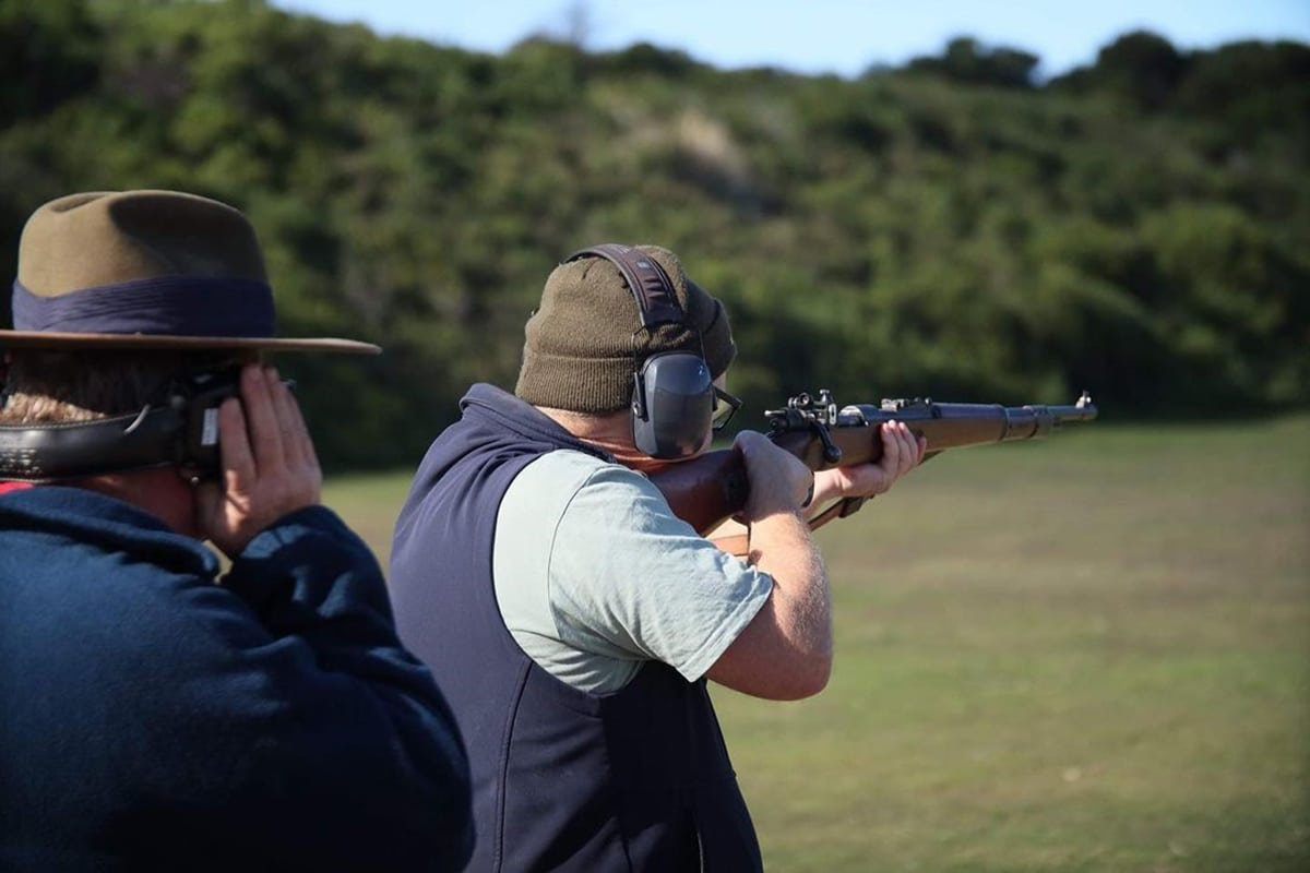 Man aiming shotgun at anzac rifle range