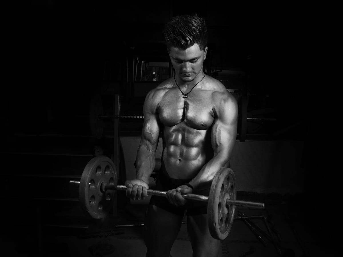 Man performing barbell curl | Image: Dreamlens Production
