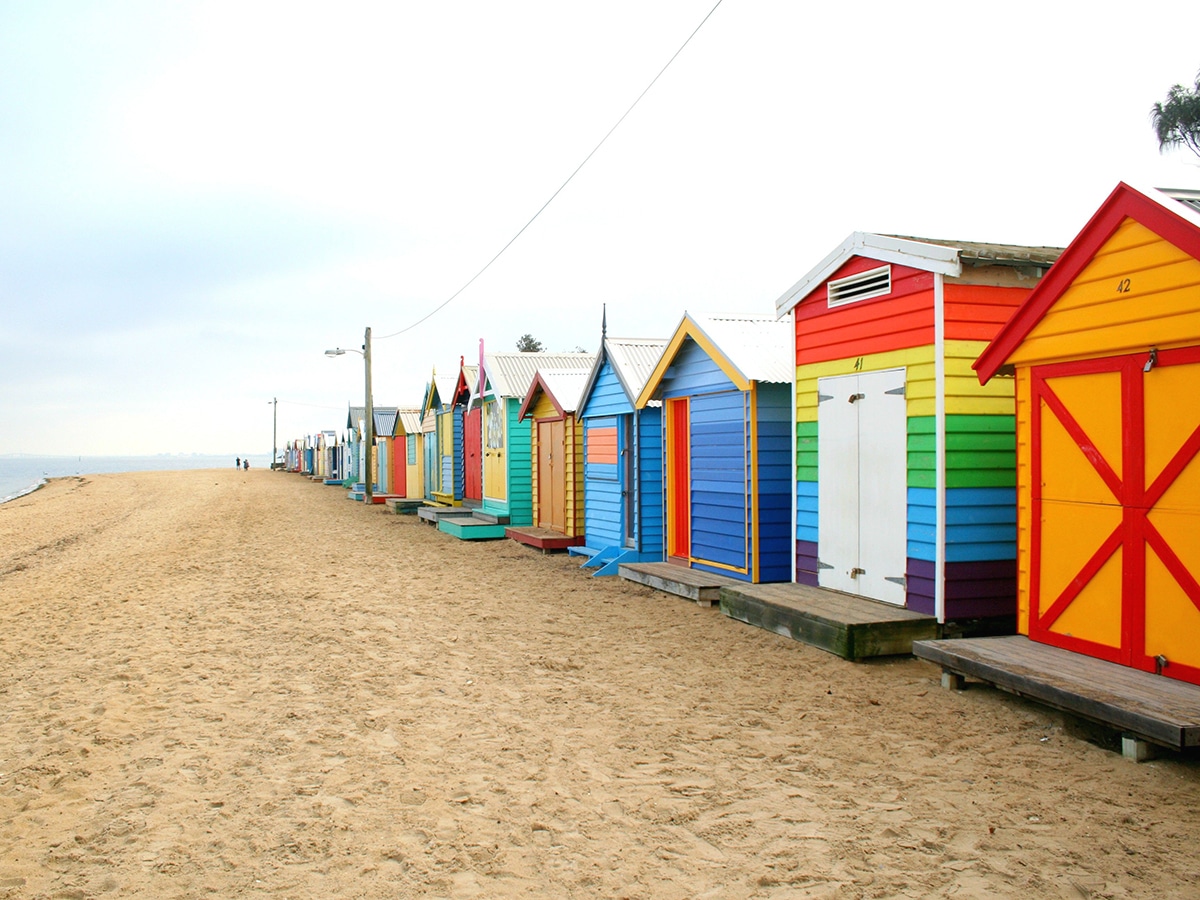 colorful wooden houses on brighton beach