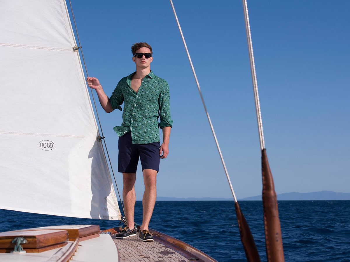 man standing on yacht in rodd and gunn clothes