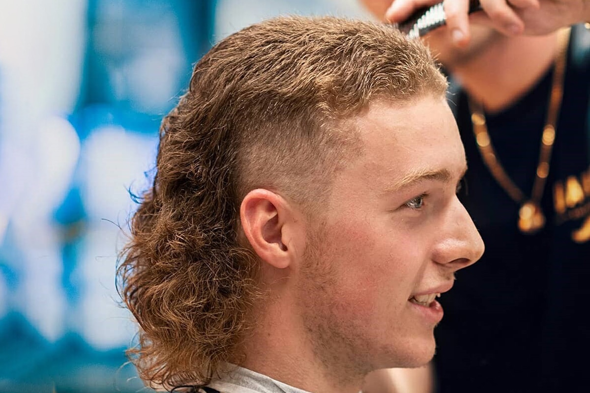 curly mullet hairstyle for men