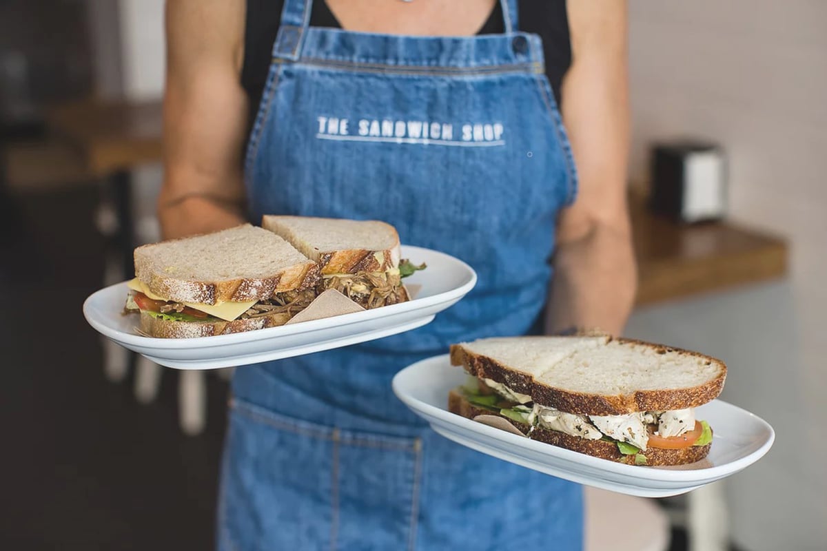 sandwich shop haymarket waitress serving sandwiches