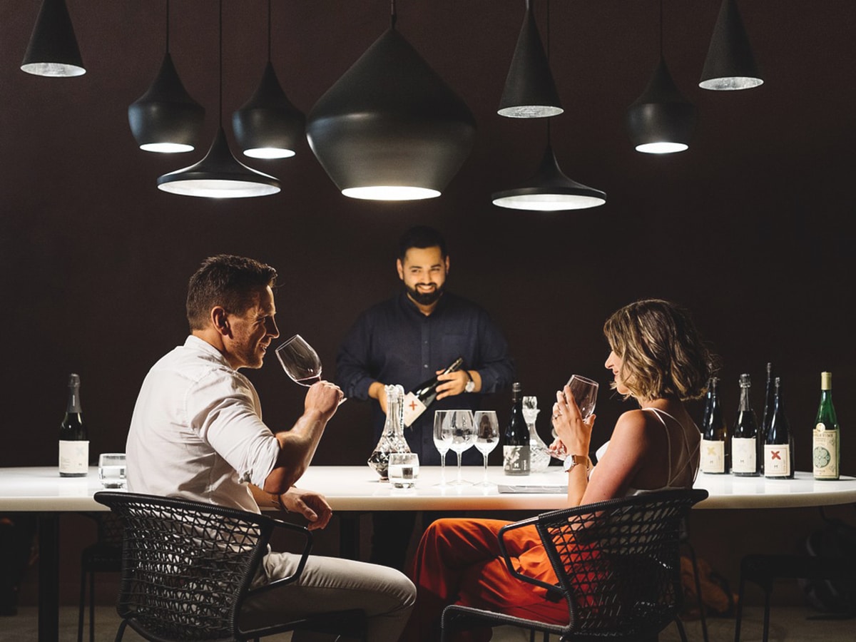 couple tasting wine at moorilla estate winery