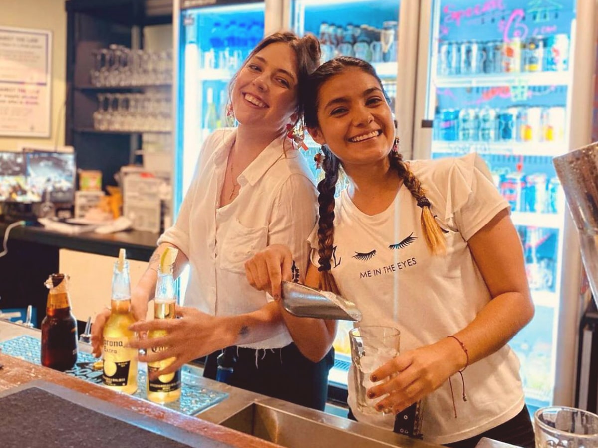 smiling bartender girls serving beer at whistle hotel northbridge