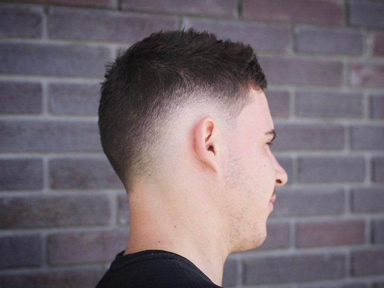 6 Best Fade Hairstyles for Men, According to a Barber Man of Many