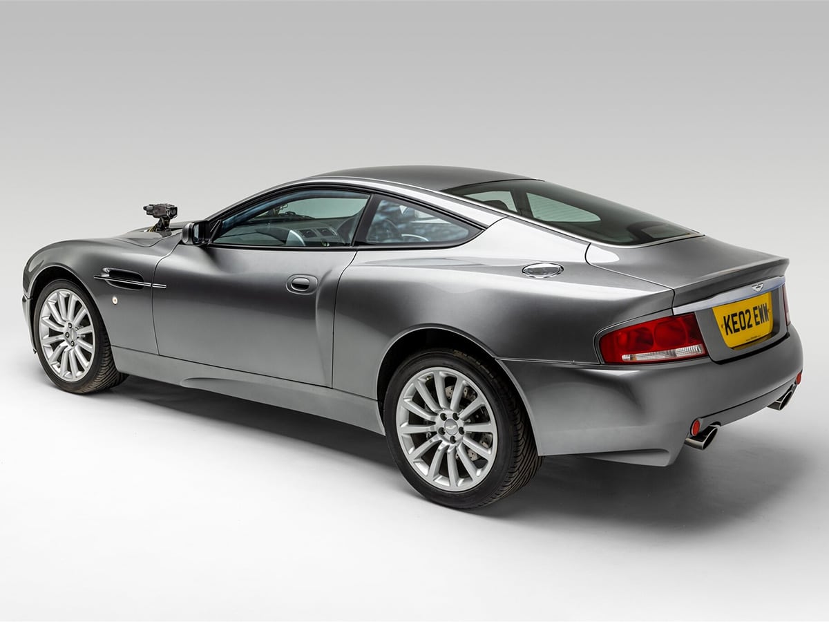 James bond car collection aston martin v12 vanguish side back view