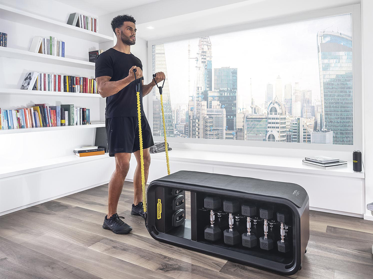 man making exercises on technogym x dior fitness collection