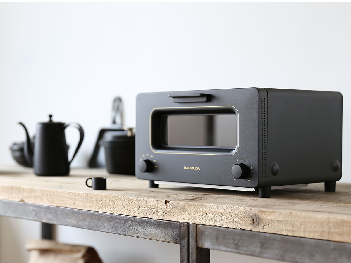 black balmuda toaster on a wooden kitchen table