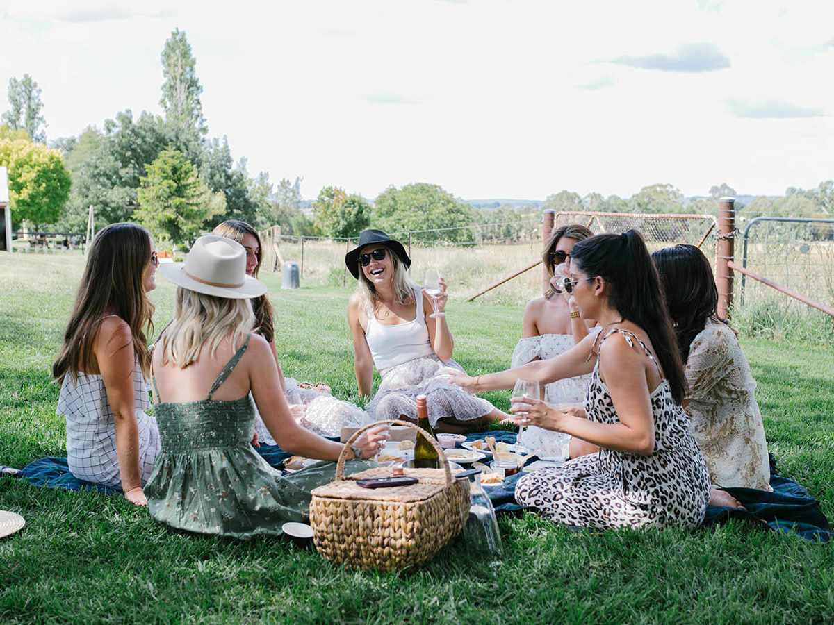 group of young women having picnic at rowlee wines