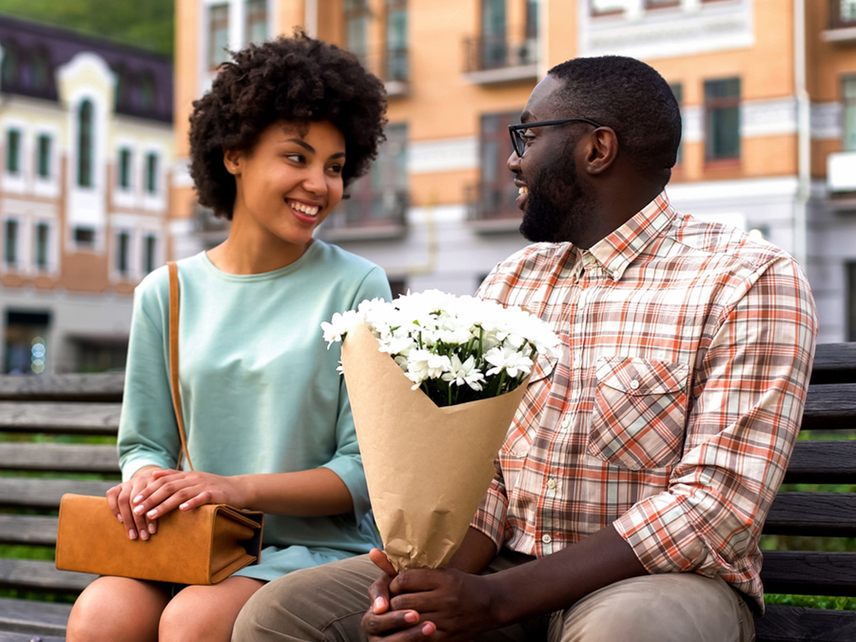 couple with flowers on the first date 