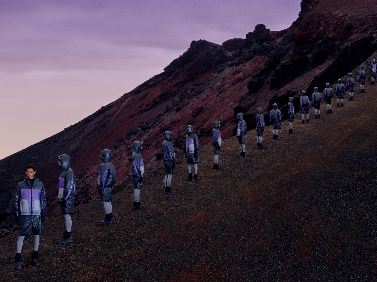 Moncler grenoble people standing on hill