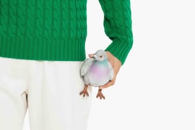 Jw anderson pigeon clutch being held 1
