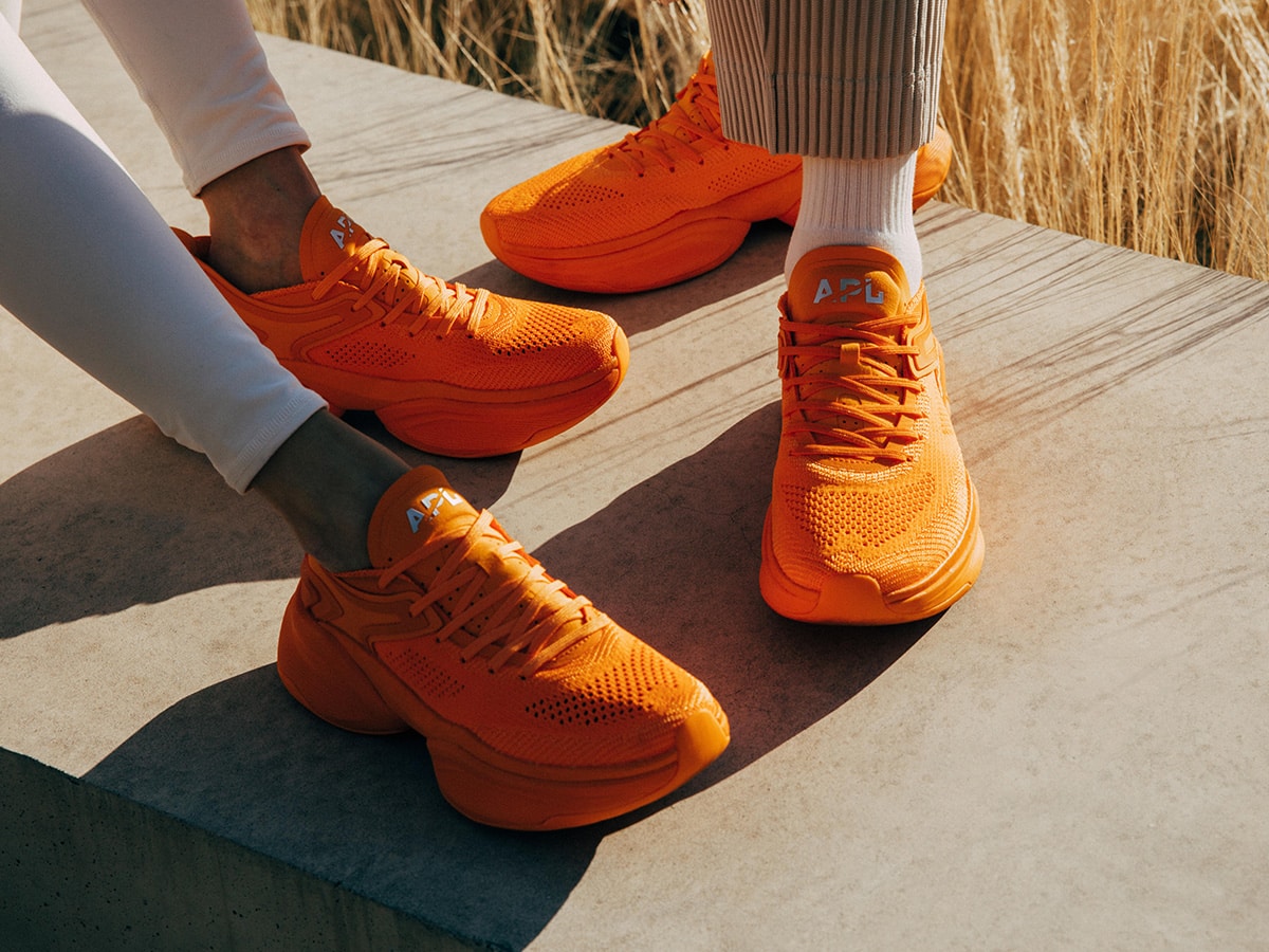 orange and burgundy sneakers