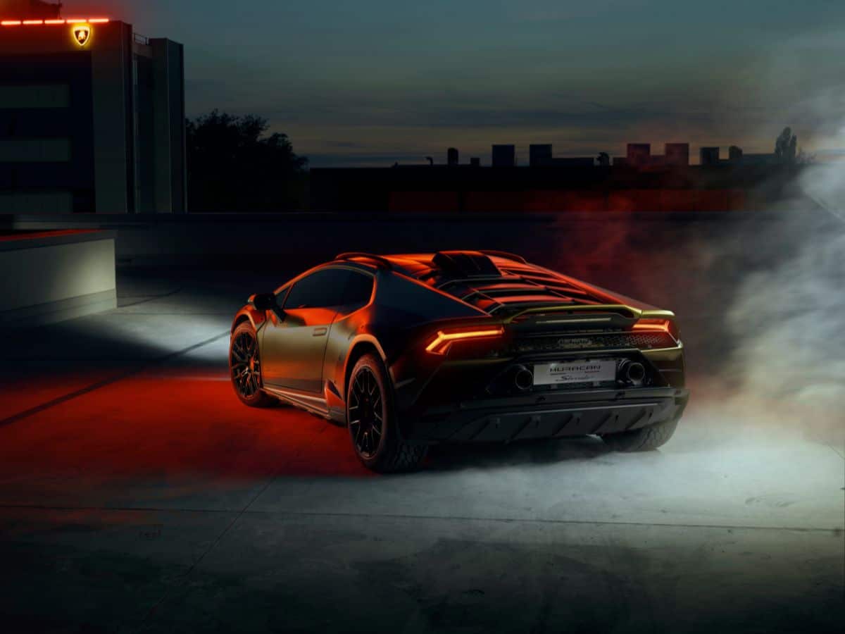 Lamborghini huracan sterrato rear end with lights on and smoke