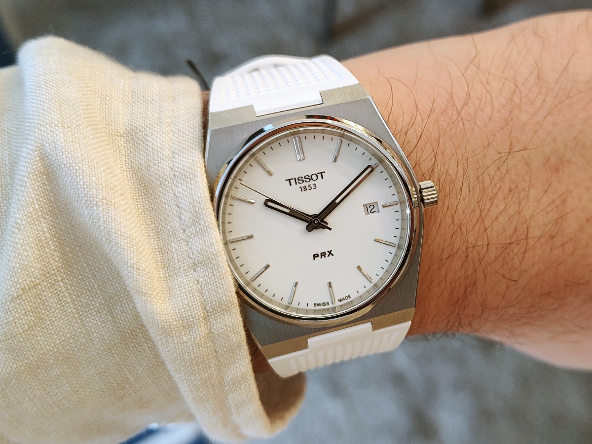 Tissot prx white dial with white rubber strap on wrist